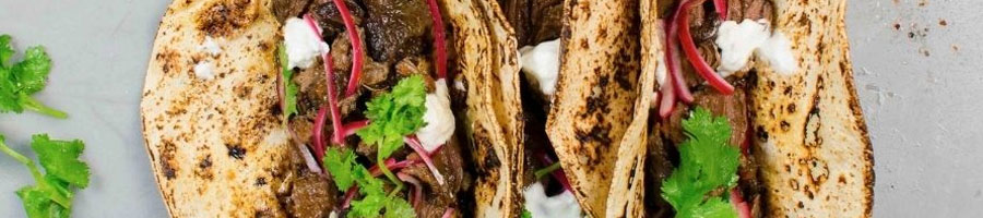 plate filled with tacos supreme