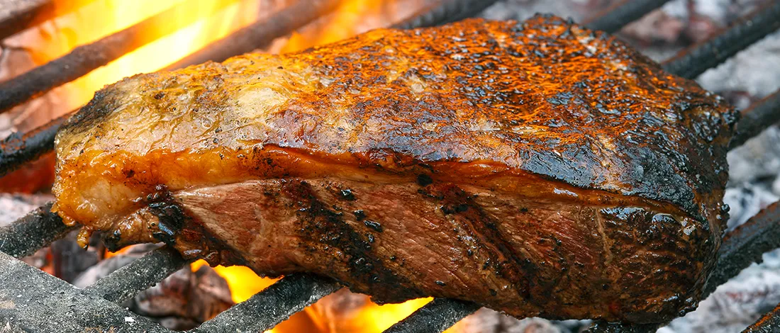 Close up image of pork ribs on grill