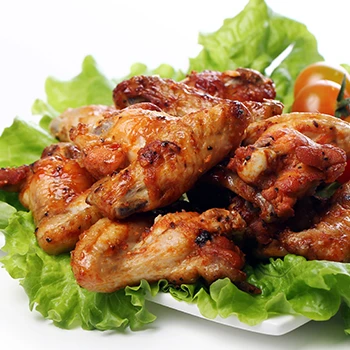 Freshly cooked chicken on top of vegetables