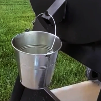 Grease bucket hanging on the Traeger grill