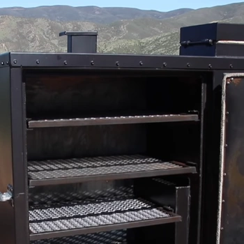 An empty inside of a gravity smoker