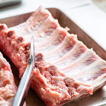 Close up image of a resting raw ribs