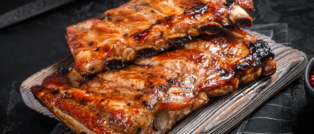 Fresh ribs on wooden board