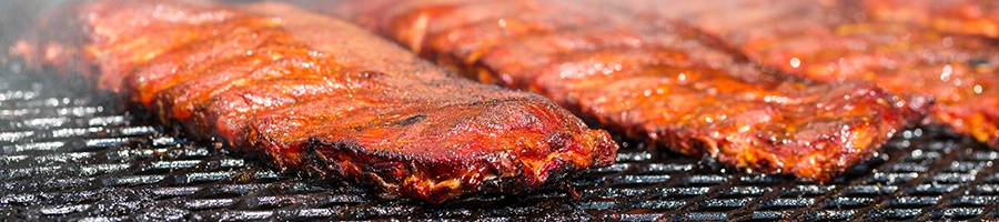 close up view of ribs getting grilled