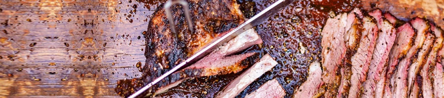 freshly cooked brisket getting sliced
