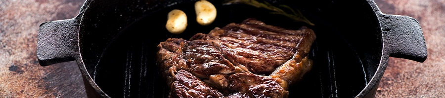 Ribeye inside a pan griller