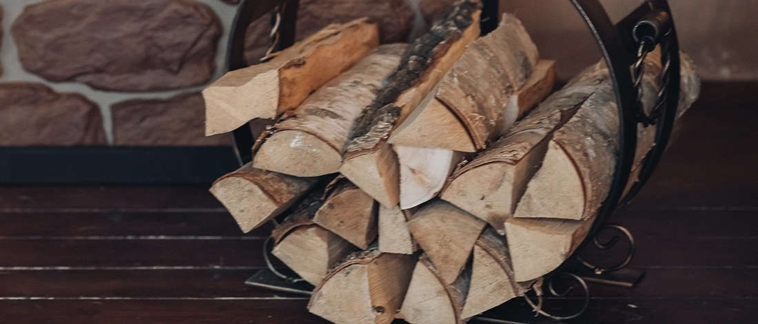 Wood logs inside a metallic holder