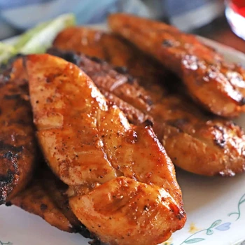plate filled with grilled barbecue chicken tenders