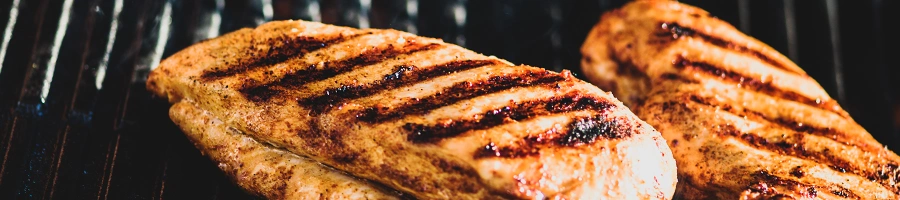 Grilling a chicken breast on a grill