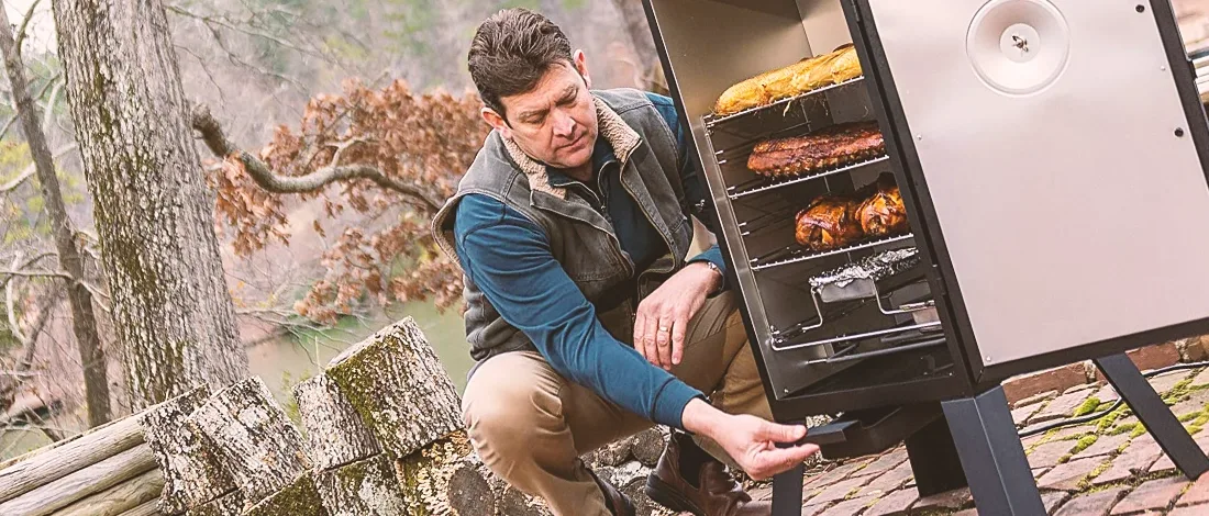 A man smoking meat