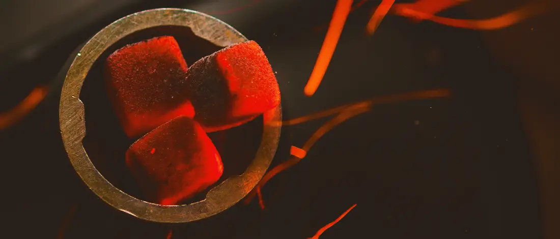 Three cubes of coal on fire