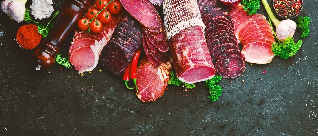 A set of beef jerky meets assembled in a line