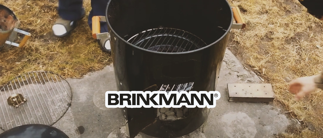 A Brinkmann smoker outside on the pavement