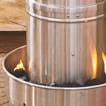 Close up shot of charcoal burning on a smoker