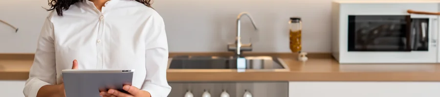 Person checking recipe notes on a tablet