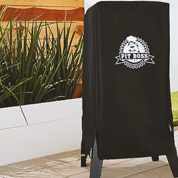 A food smoker covered with a cloth cover
