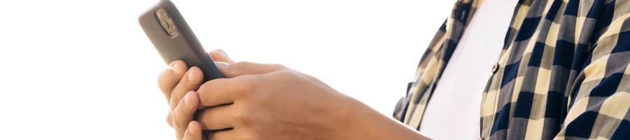 A person browsing through his phone