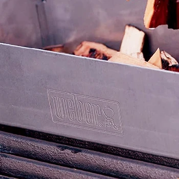 A close up image of Weber smoker box