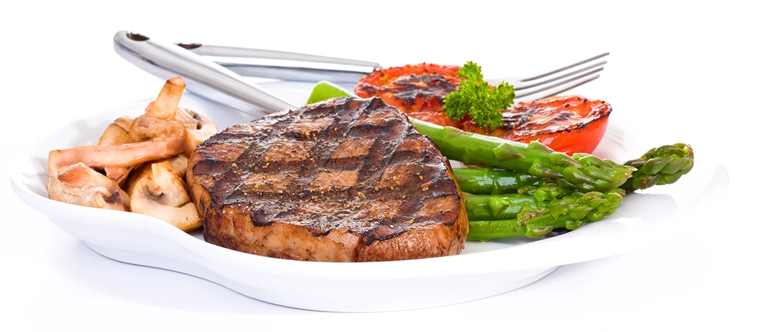 A close up image of a carnivore meal on a white plate