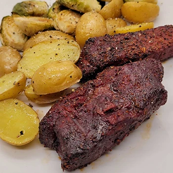 A country-style smoked pork ribs with potatoes on a plate