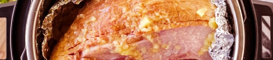 A top view of a ham being cooked in a pressure cooker