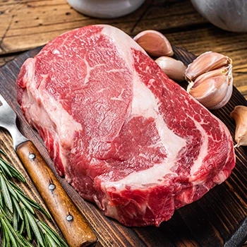 A raw ribeye cut of beef