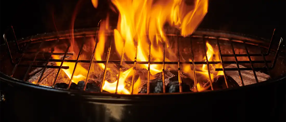 burning charcoal grill