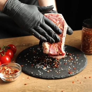 Rubbing the meat with seasonings