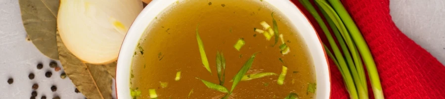 Making a beef bone broth in a bowl