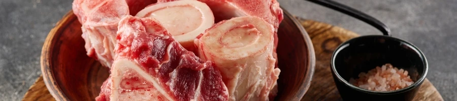 Beef bones on a wooden bowl