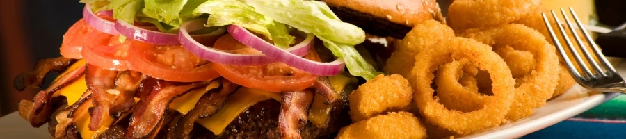 A burger with complete toppings and condiments