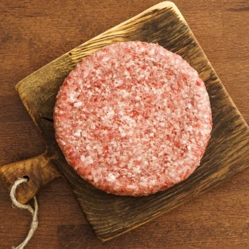 A top view of a raw burger patty