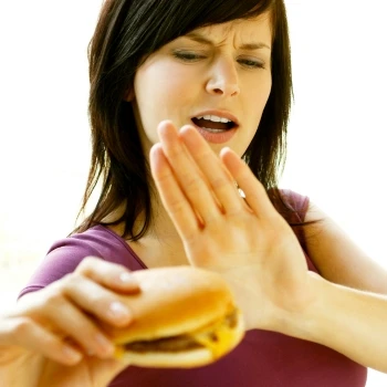 A woman refraining from eating meat
