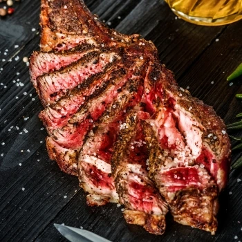 A thin sliced medium rare steak.