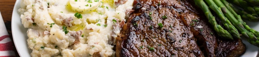 A balsamic rosemary beef steak tips with a garlic mashed potato as a side dish