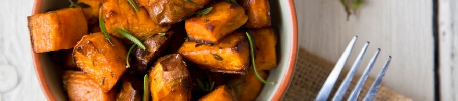 A roasted sweet potato on a bowl
