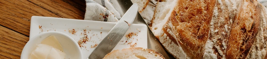 A crusty bread as side dish of braised steak