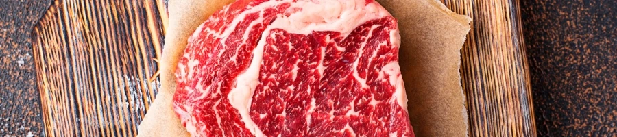 Marbled steak on a cutting board