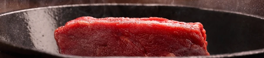 Cooking steak on a cast iron pan