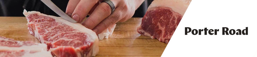 Man slicing fresh meat using a knife, and Porter Road logo