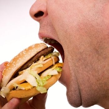 man eating burger