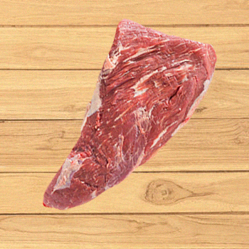 A tri tip cut steak on a wooden table