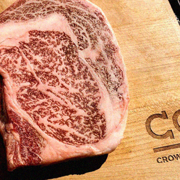 Wagyu beef on top of a Crowd Cow laser engraved chopping board