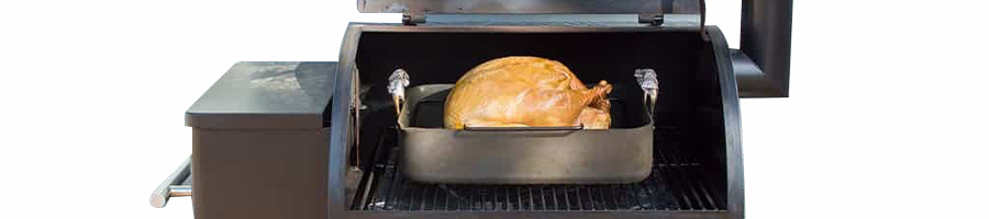 Turkey on a pellet grill with a drip pan underneath