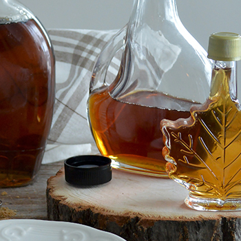 Maple syrups in a bottle glass