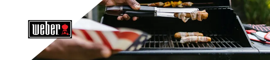 Grilling hotdogs outdoors with a Weber logo