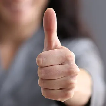 hand view of a person giving a thumbs up