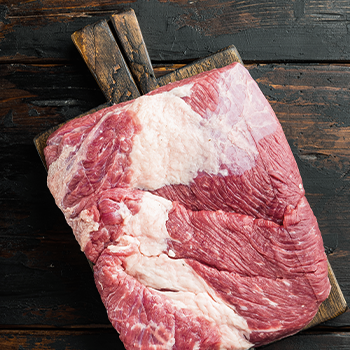 Well-prepared brisket on top of a cutting board