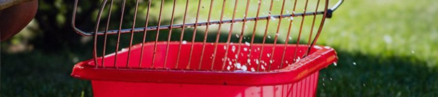 Stainless grill getting soaked in a container