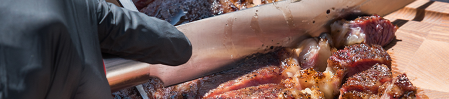 Close up cutting brisket meat